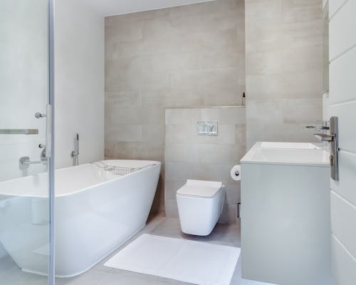 Modern white bathroom with glass shower