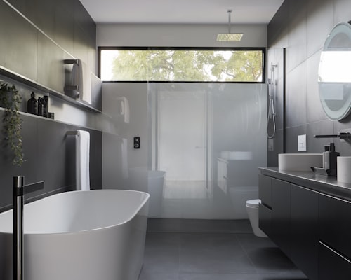 Spacious bathroom with glass enclosure